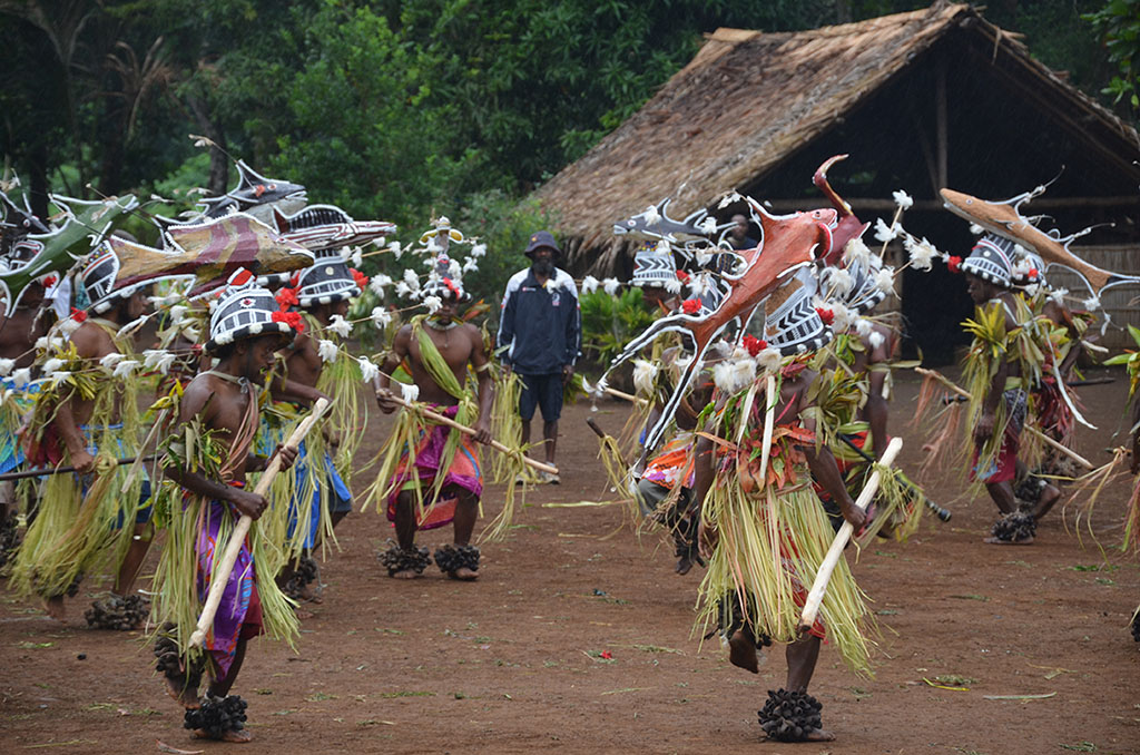 Men in ceremonial dress dancing